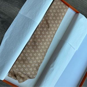 Hermès 100% Silk Orange Medallion Repeating Pattern Tie
